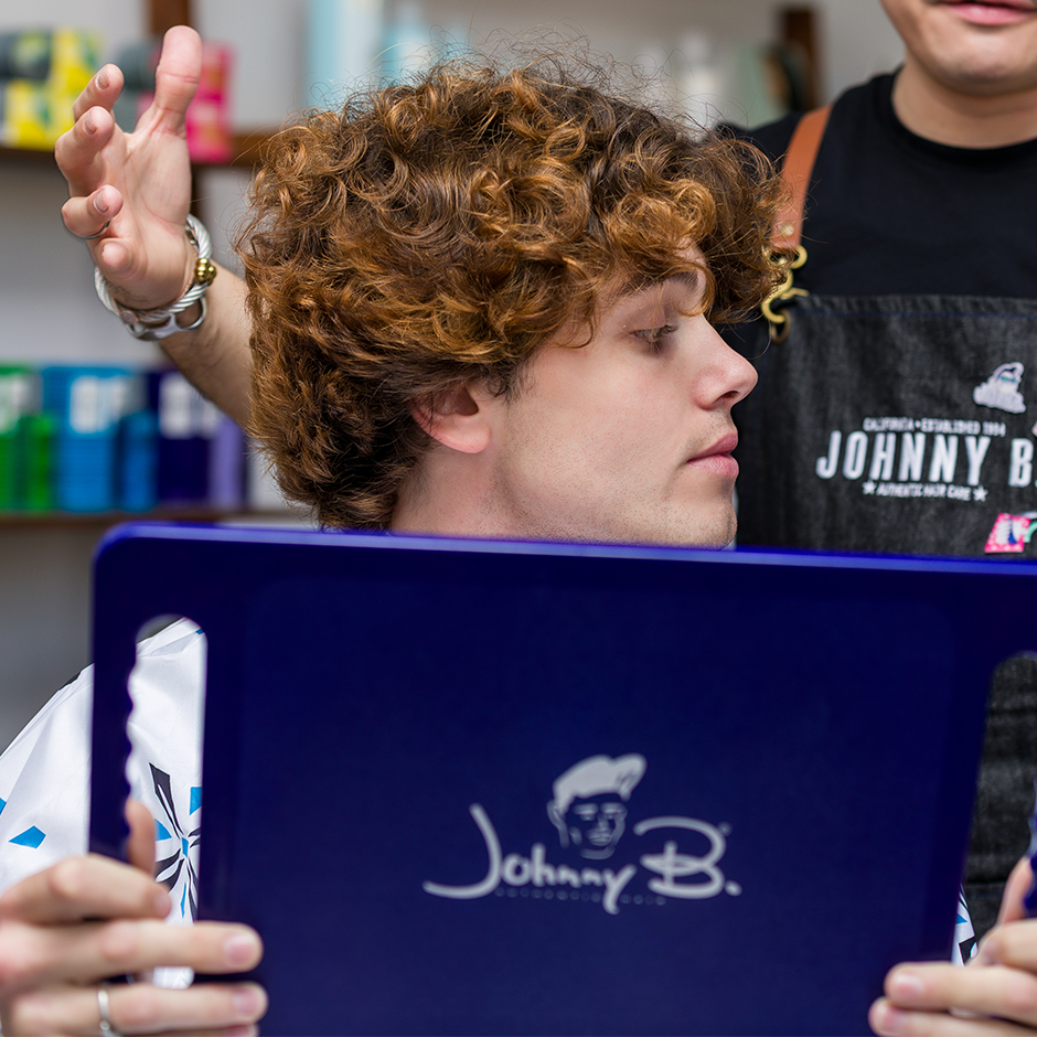 Man holding Johnny. B mirror