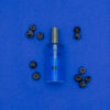 Blueberries laid around a PM After Shave 3.3oz bottle