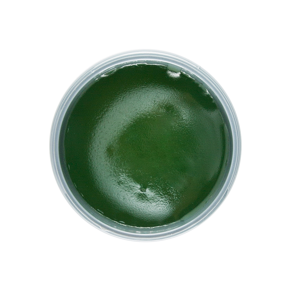 Johnny B. Dope with lid open, revealing the green colored pomade