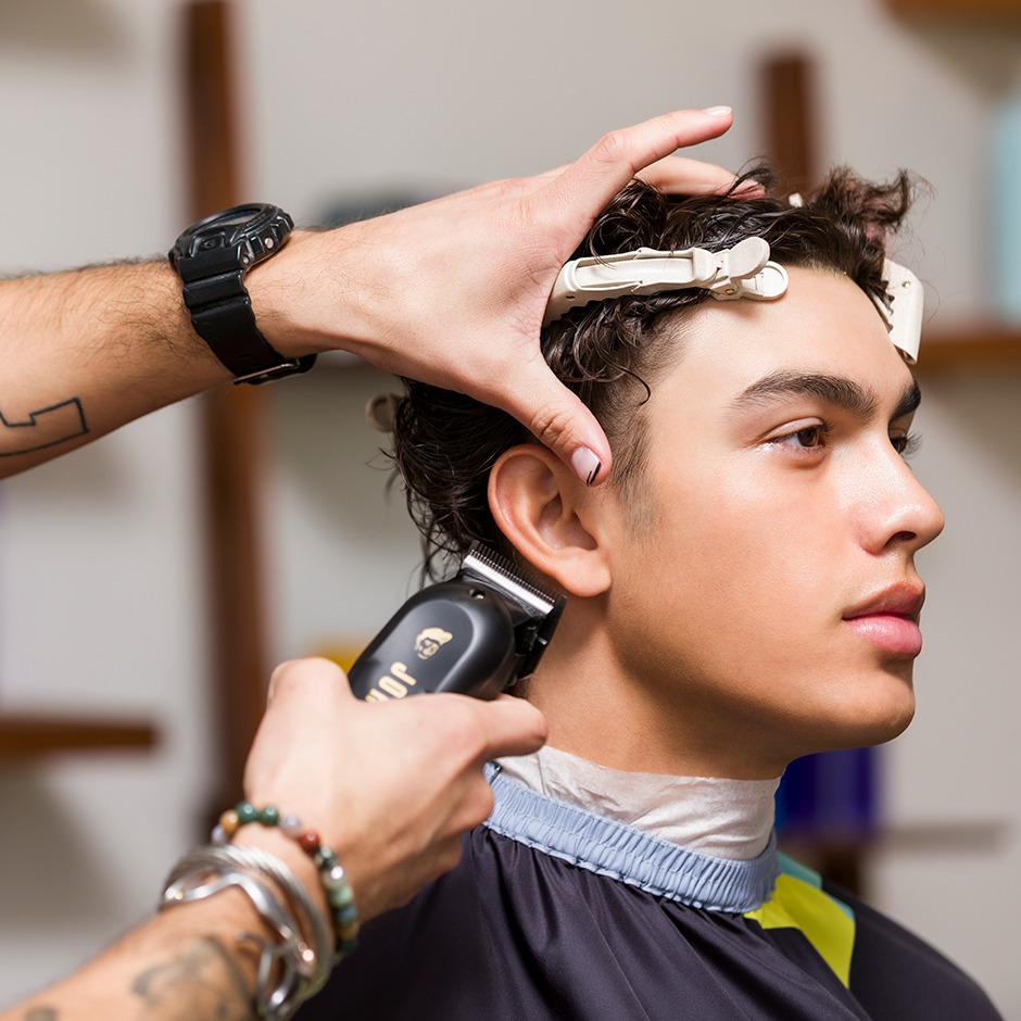 Barber using Odyssey Clipper on customer hair