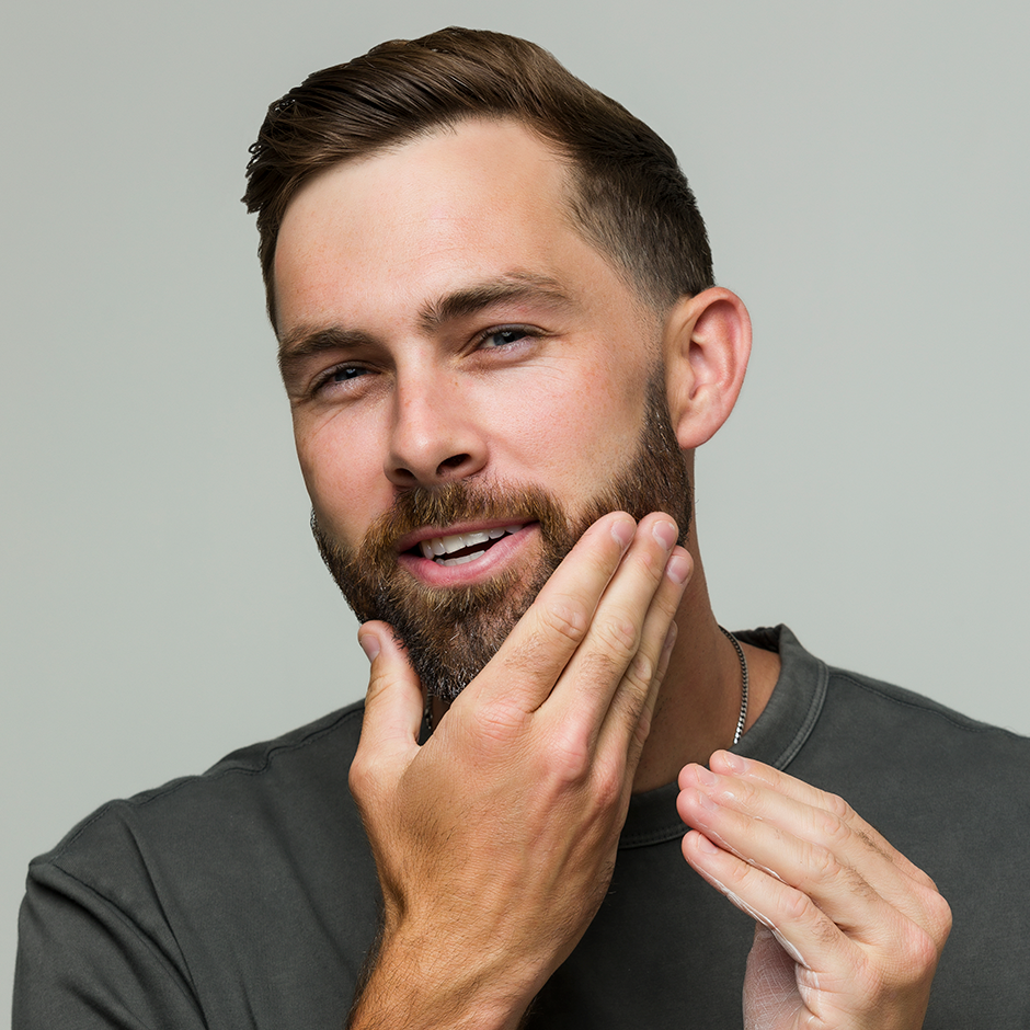 Man using Utility Cream to moisturize beard