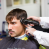 Barber using Odyssey clipper to cut hair